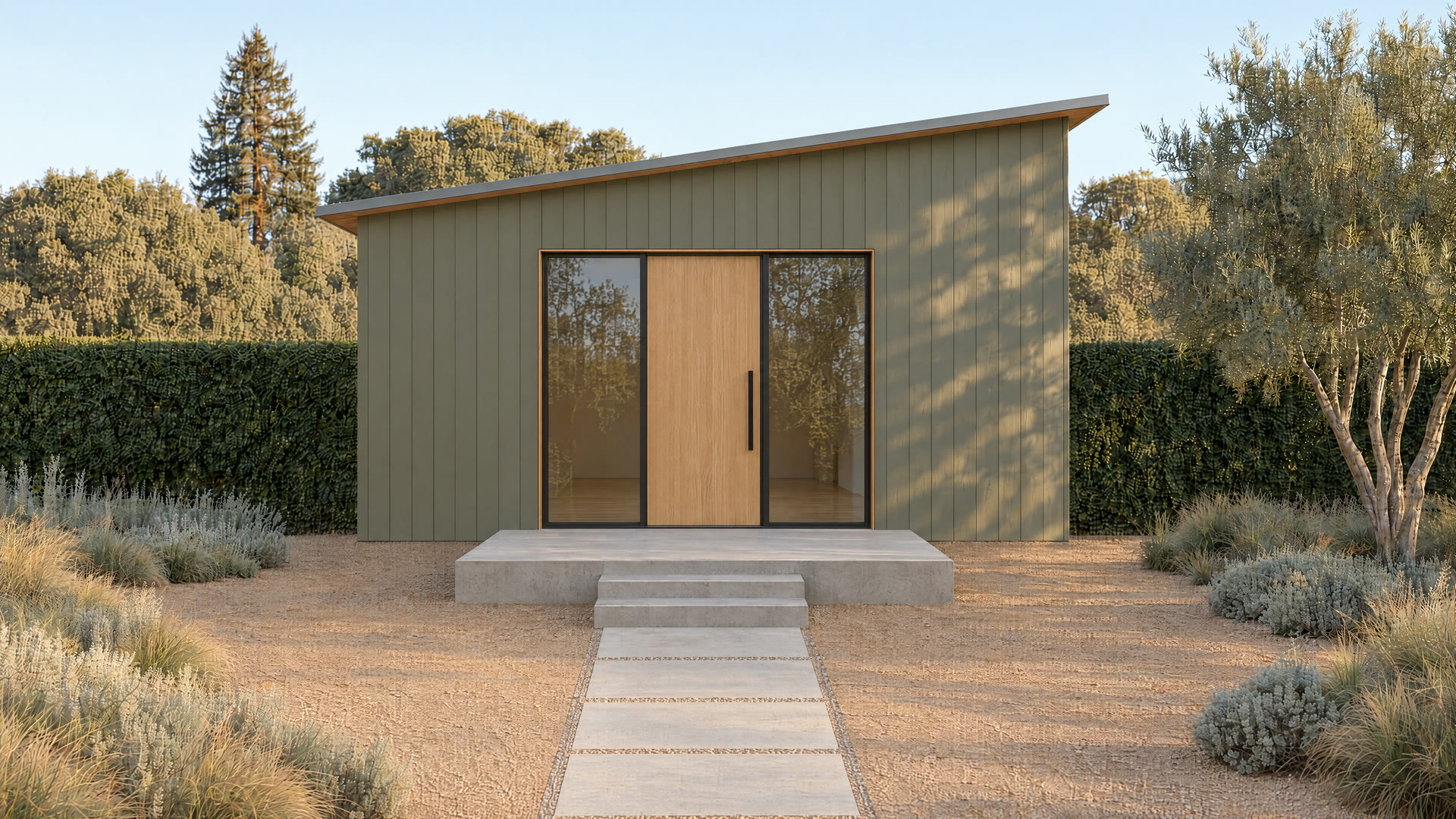 Small white backyard cottage in afternoon light